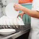 person washing dishes